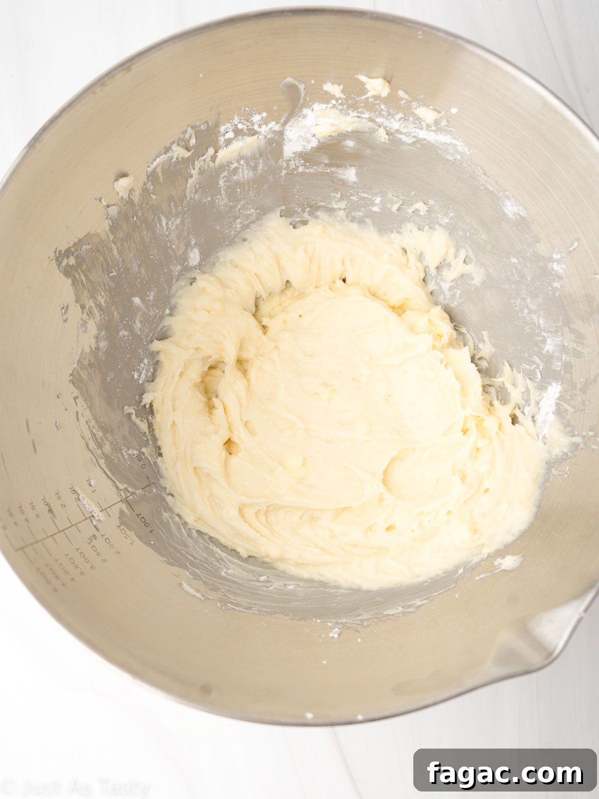 Gluten-Free Red Velvet Cake Recipe — Moist, Classic Flavor 10 Cream cheese frosting in a mixing bowl.