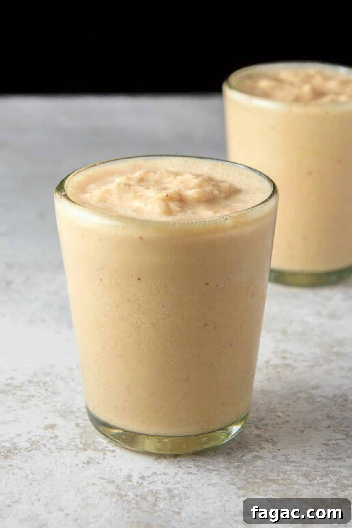 Close view of the mango smoothie in two glasses
