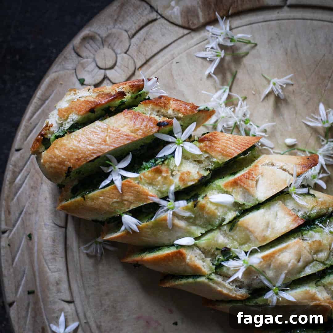 Crispy Wild Garlic Bread Recipe for Spring Gatherings 3 Freshly baked golden garlic bread scattered with tiny white wild garlic flowers