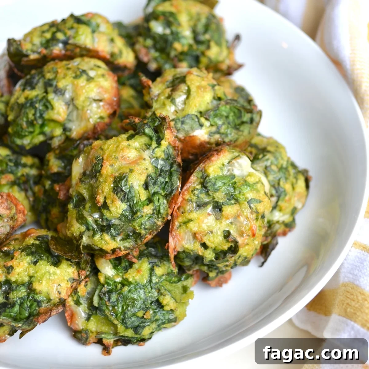 Spinach Balls Recipe with WW Points and Nutrition Info 2 Spinach balls on a playe