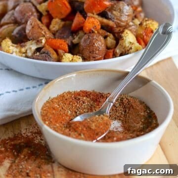 A white bowl with a spoonful of homemade vegetable seasoning mix.
