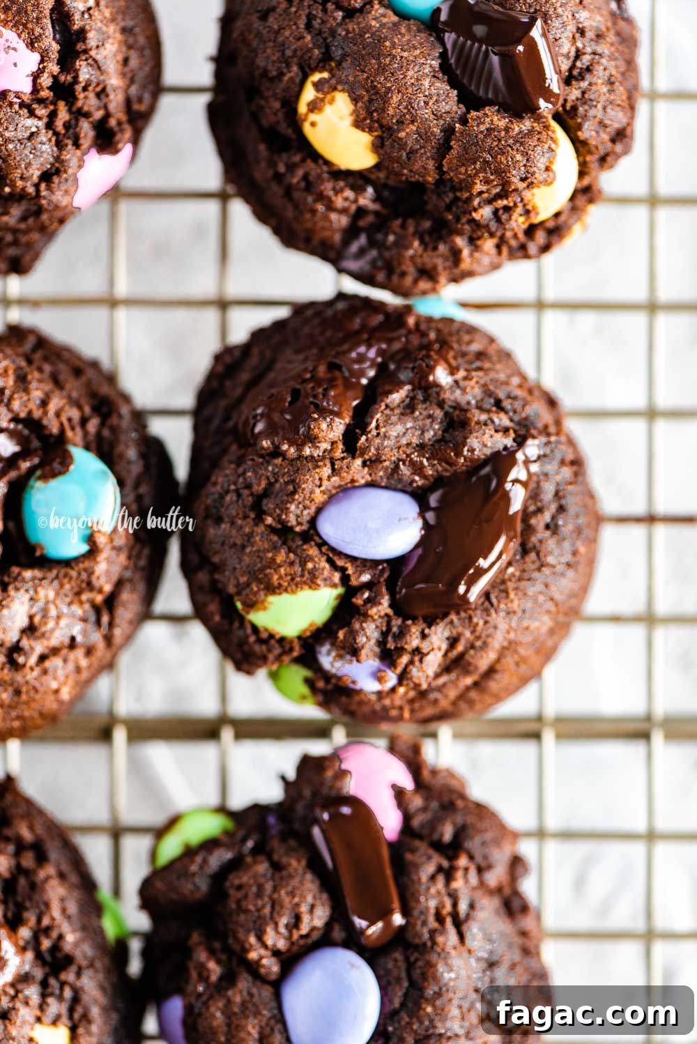 Closeup overhead image of double chocolate chunk cookies on a wire cooling rack | All Images © Beyond the Butter™