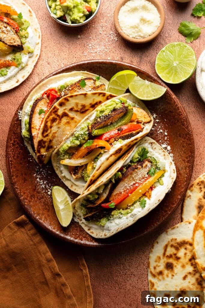 Weeknight Sheet Pan Chicken Fajitas Recipe for Quick Dinners 10 A plate of three assembled fajitas on a brown surface.
