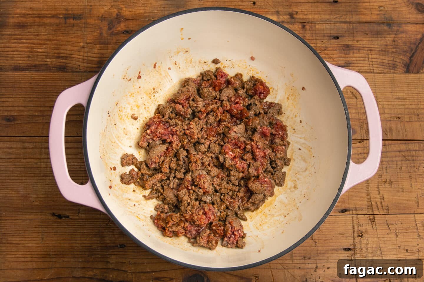 Creamy Beef Taco Soup Recipe with Cheesy Tortilla Toppings 4 This is a picture of a large pot with ground beef cooking.