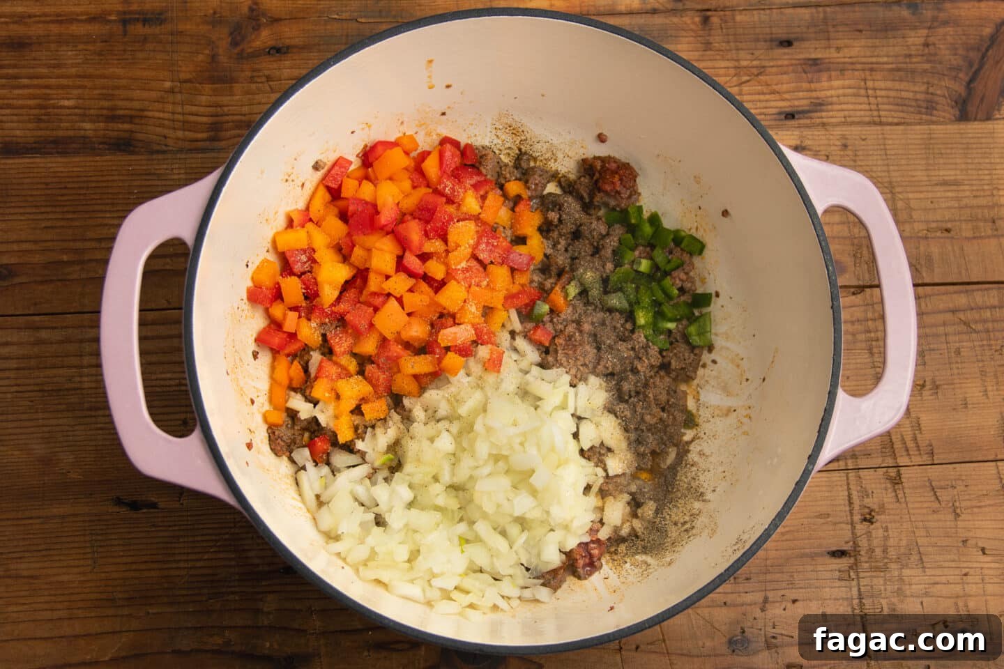Creamy Beef Taco Soup Recipe with Cheesy Tortilla Toppings 5 This is a picture of the pot with veggies added to the beef.