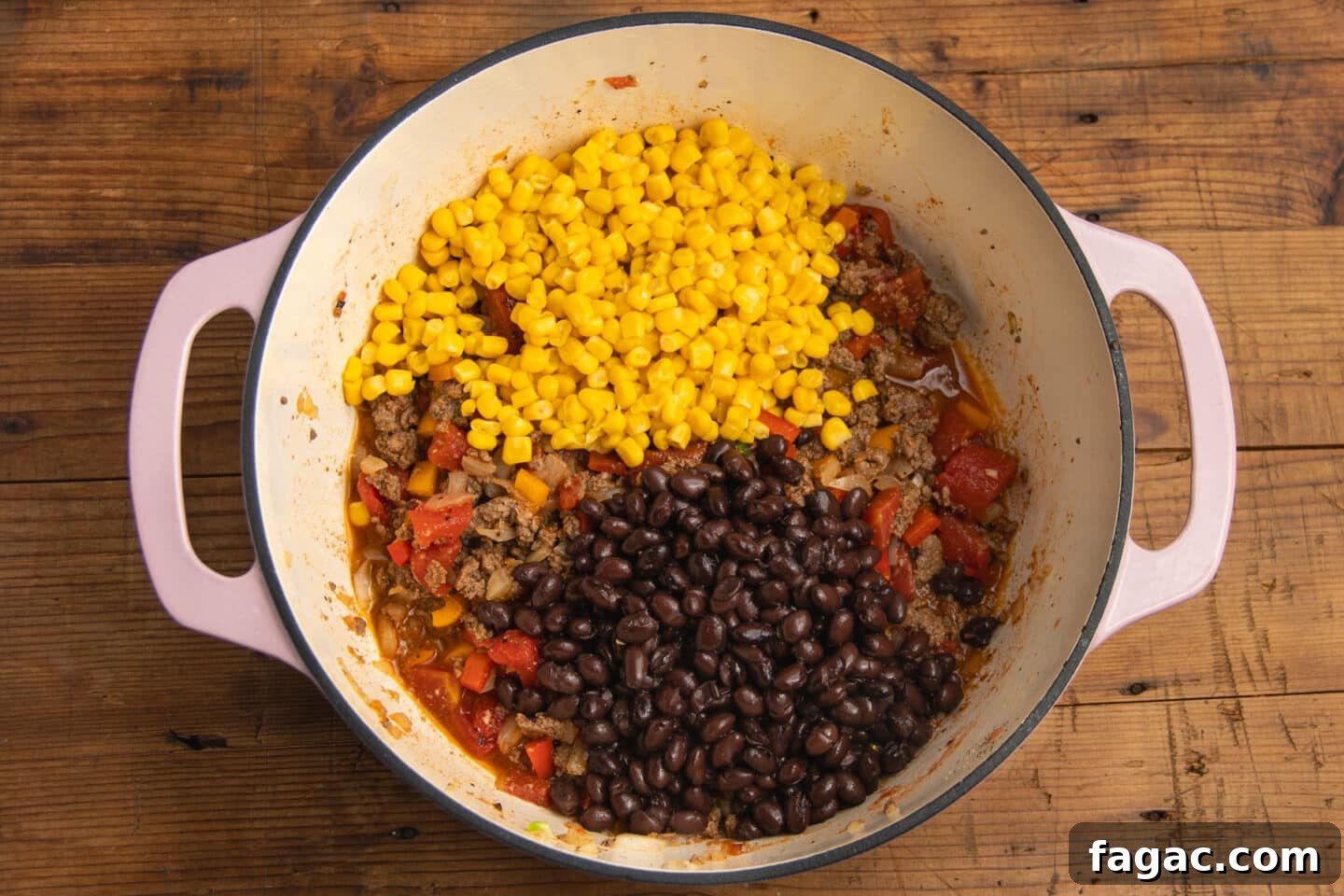 Creamy Beef Taco Soup Recipe with Cheesy Tortilla Toppings 7 This is a picture of the pot with the corn and beans added to the soup.