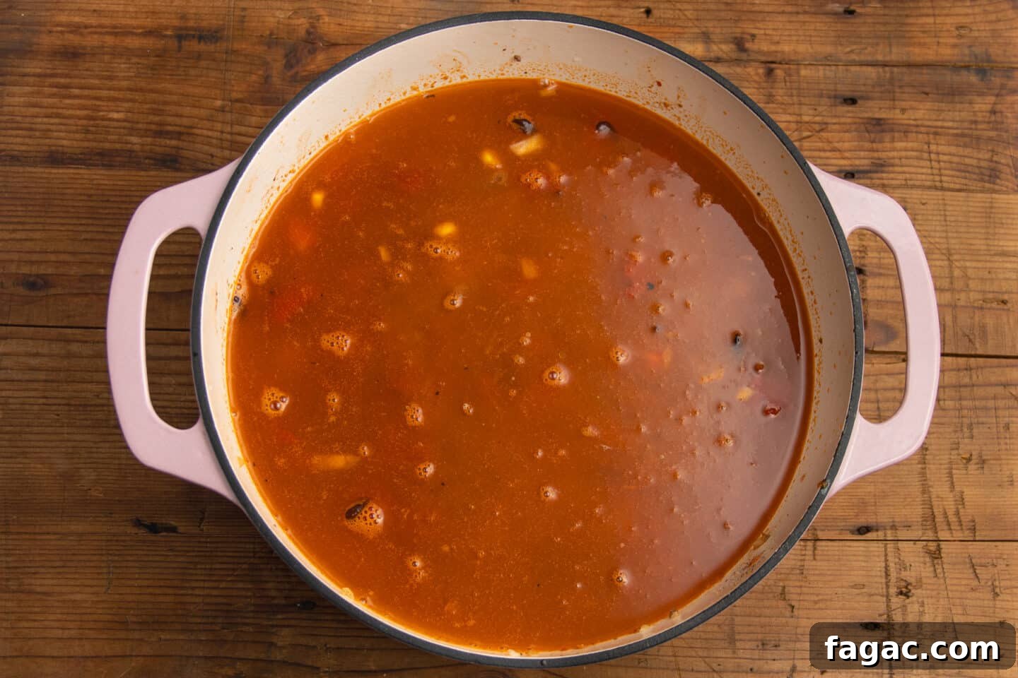 Creamy Beef Taco Soup Recipe with Cheesy Tortilla Toppings 8 This is a picture of the pot with the broth added to the soup.