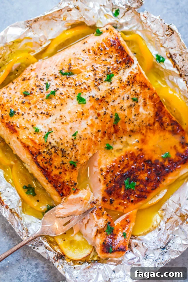 Sheet Pan Lemon Garlic Butter Salmon — Juicy salmon at home in 30 minutes that's EASY and tastes BETTER than from a restaurant! The butter is infused with lemon and garlic and adds so much FLAVOR!