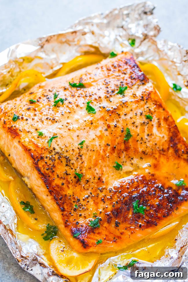 Sheet Pan Lemon Garlic Butter Salmon — Juicy salmon at home in 30 minutes that's EASY and tastes BETTER than from a restaurant! The butter is infused with lemon and garlic and adds so much FLAVOR!