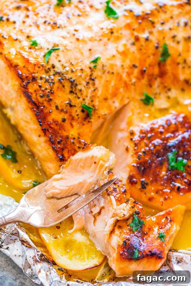 Sheet Pan Lemon Garlic Butter Salmon — Juicy salmon at home in 30 minutes that's EASY and tastes BETTER than from a restaurant! The butter is infused with lemon and garlic and adds so much FLAVOR!