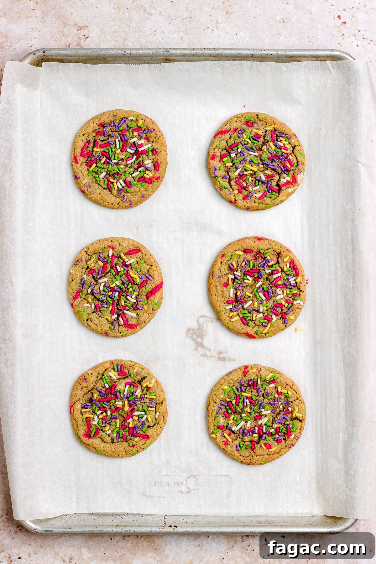 Sprinkle sugar cookies on a parchment paper lined baking sheet.