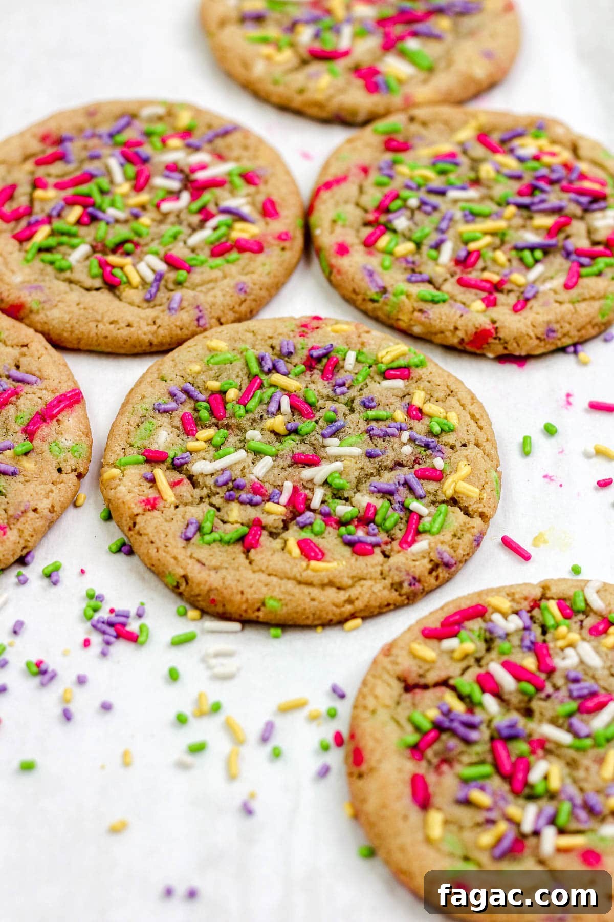 Sprinkle sugar cookies on a parchment paper lined baking sheet.