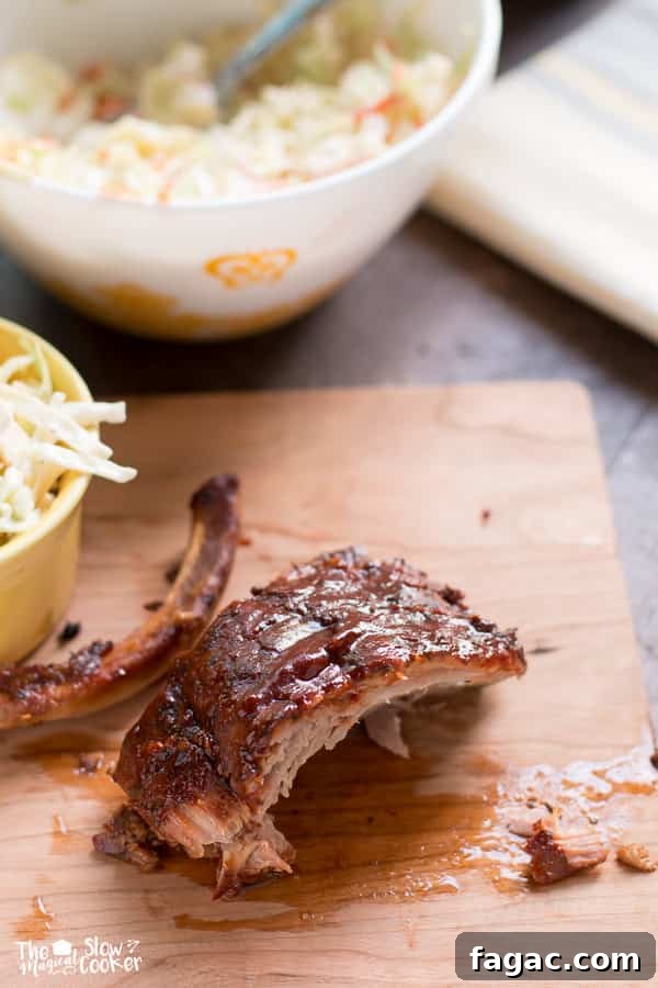 Cajun Slow Cooker Louisiana Ribs Recipe 7 Ribs on cutting board, ready to eat.