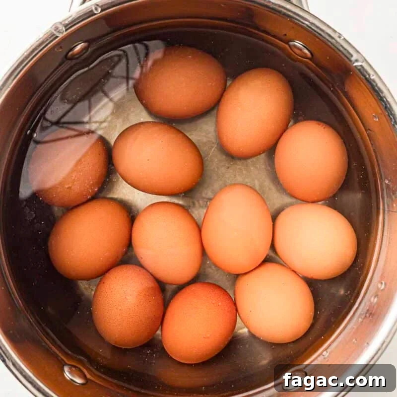Process step 1 - hard boil the eggs. Drain and transfer the eggs to cold water until fully cooled.