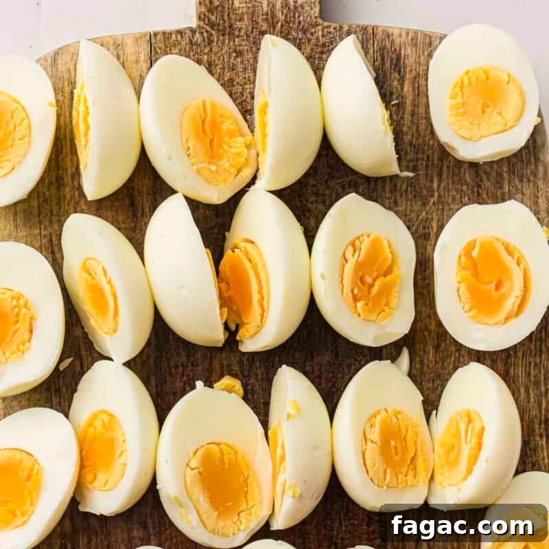 Process step 2 - peel the eggs and slice each one in half lengthwise.
