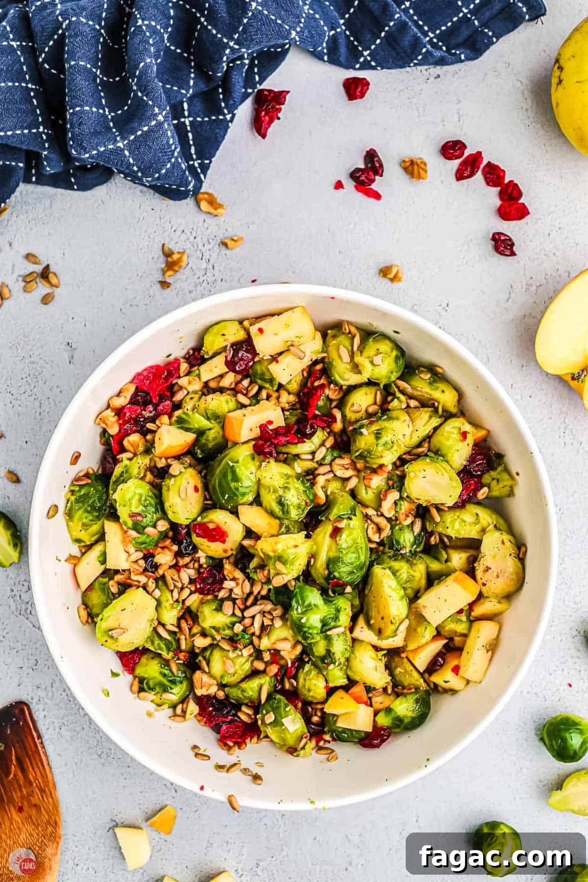 Shaved Brussels Sprouts and Cranberry Salad with Toasted Almonds 8 bowl of salad with cranberries and apples
