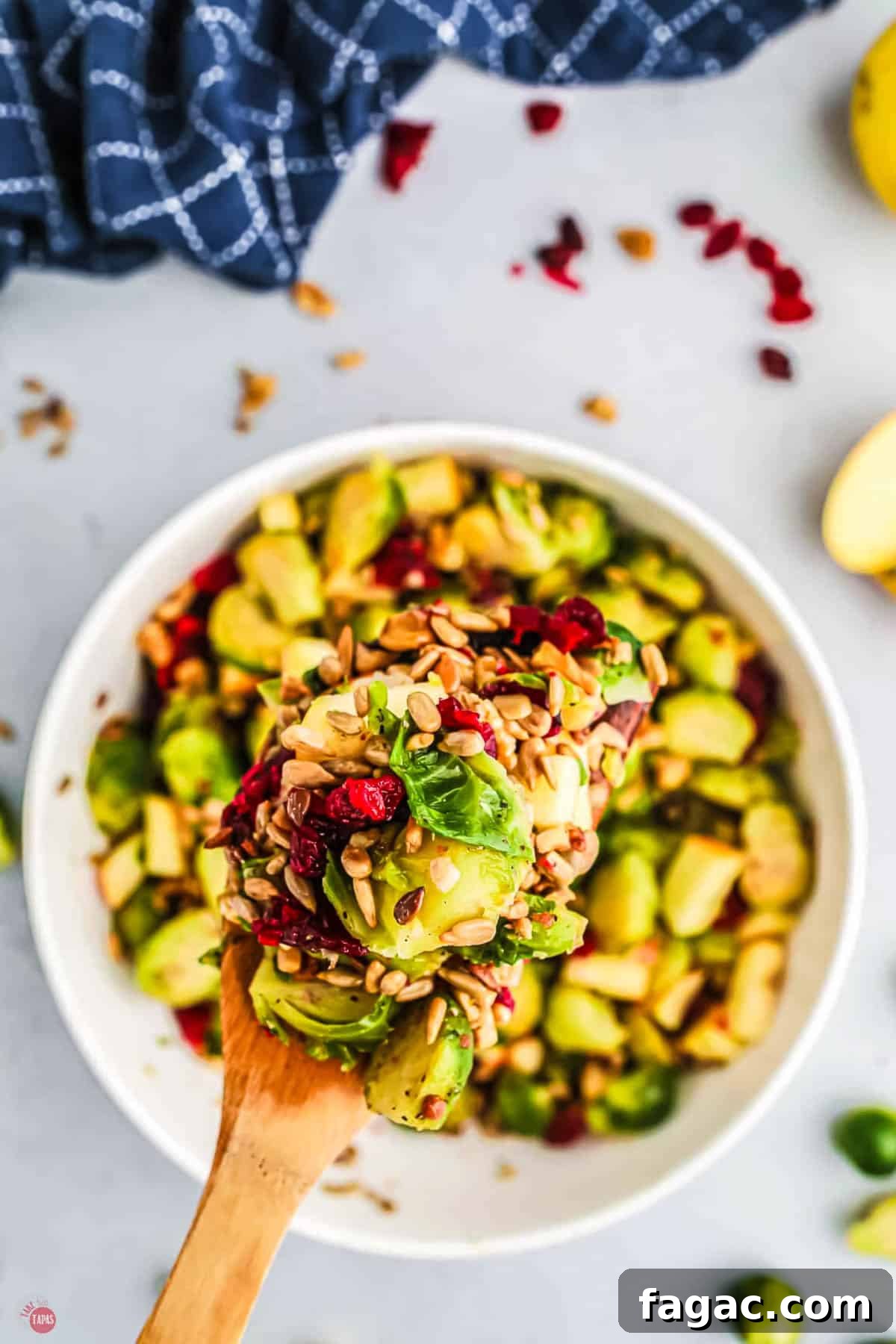 Shaved Brussels Sprouts and Cranberry Salad with Toasted Almonds 10 wood spoon of sprouts salad
