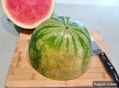 How to Cut a Watermelon: With the Rind and Without It 10 cut melon in half - watermarked