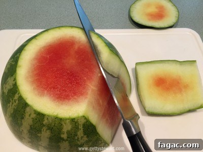 How to Cut a Watermelon: With the Rind and Without It 13 continue cutting all the way around - watermarked
