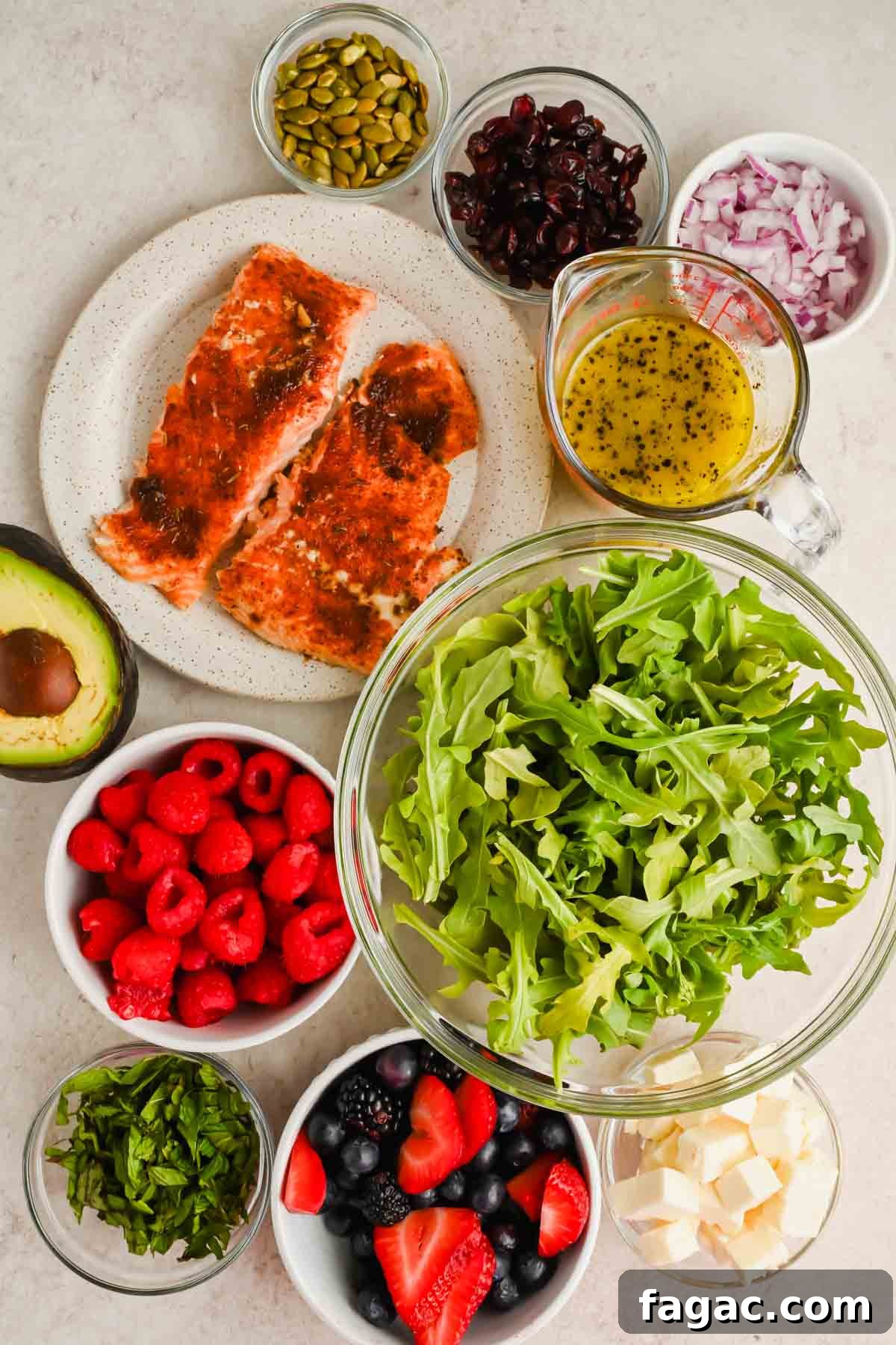 ingredients for salad with berries in individual bowls.