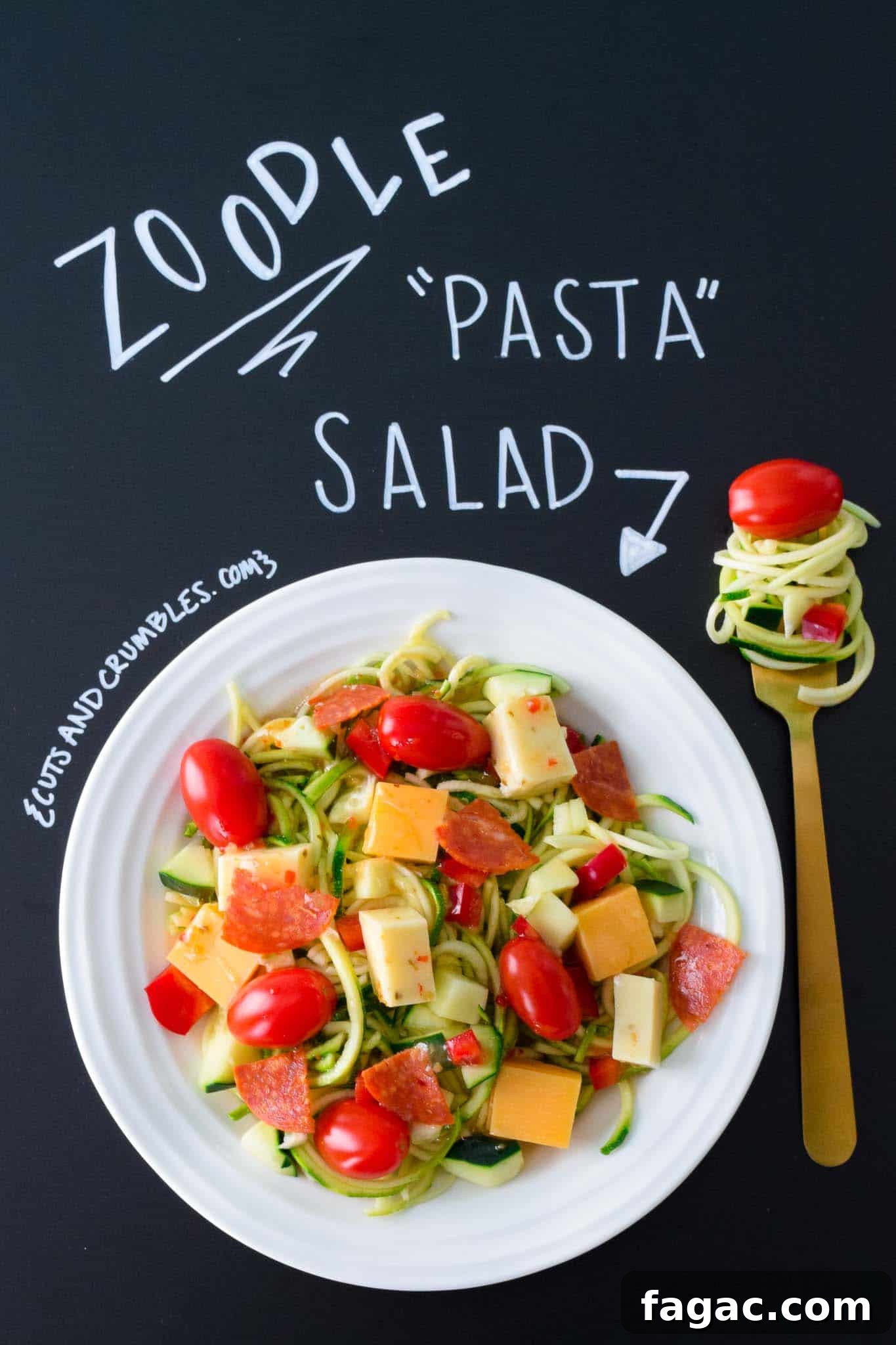 Zoodle Pasta Salad in white bowl with title written on chalkboard