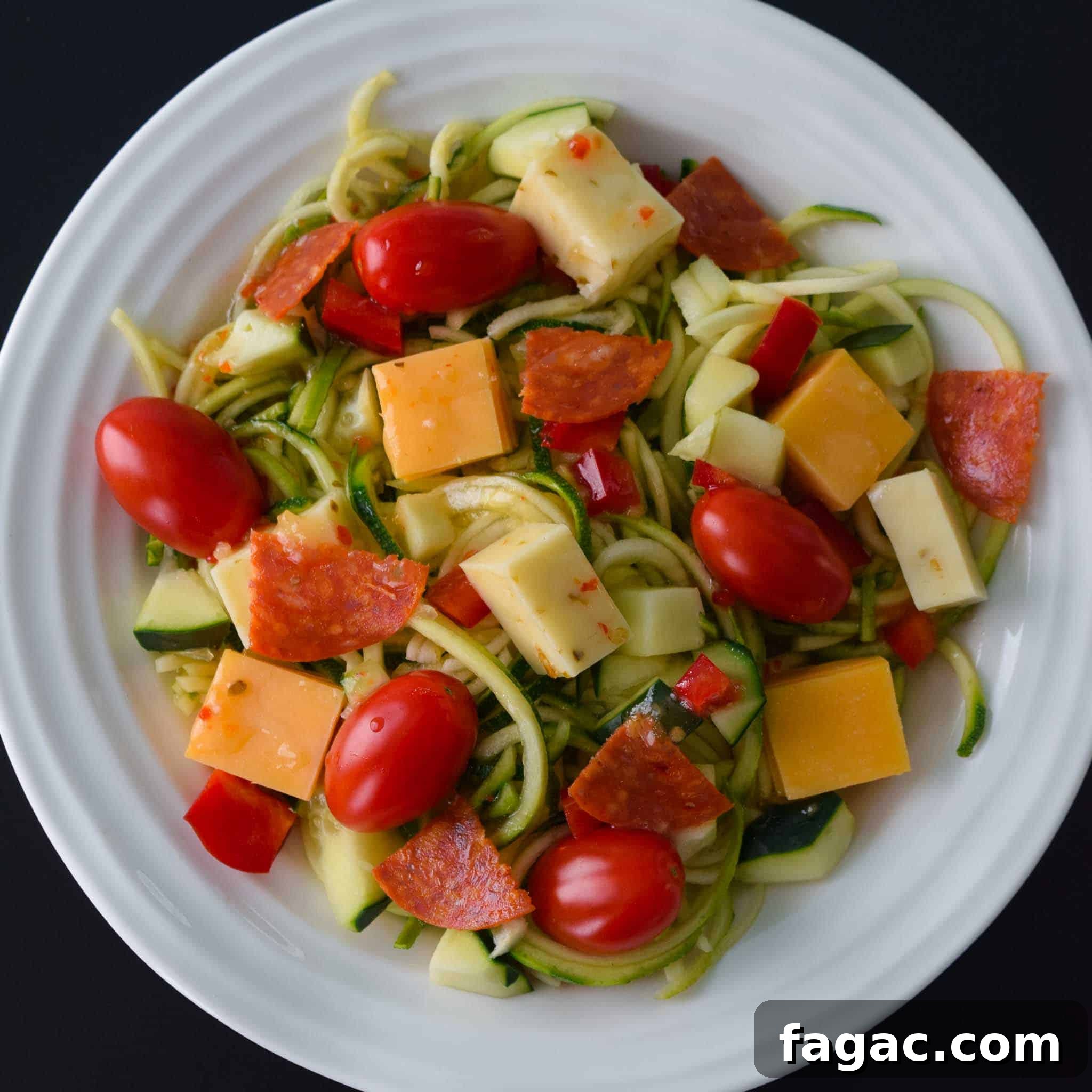 Zoodle Pasta Salad in white bowl overhead shot
