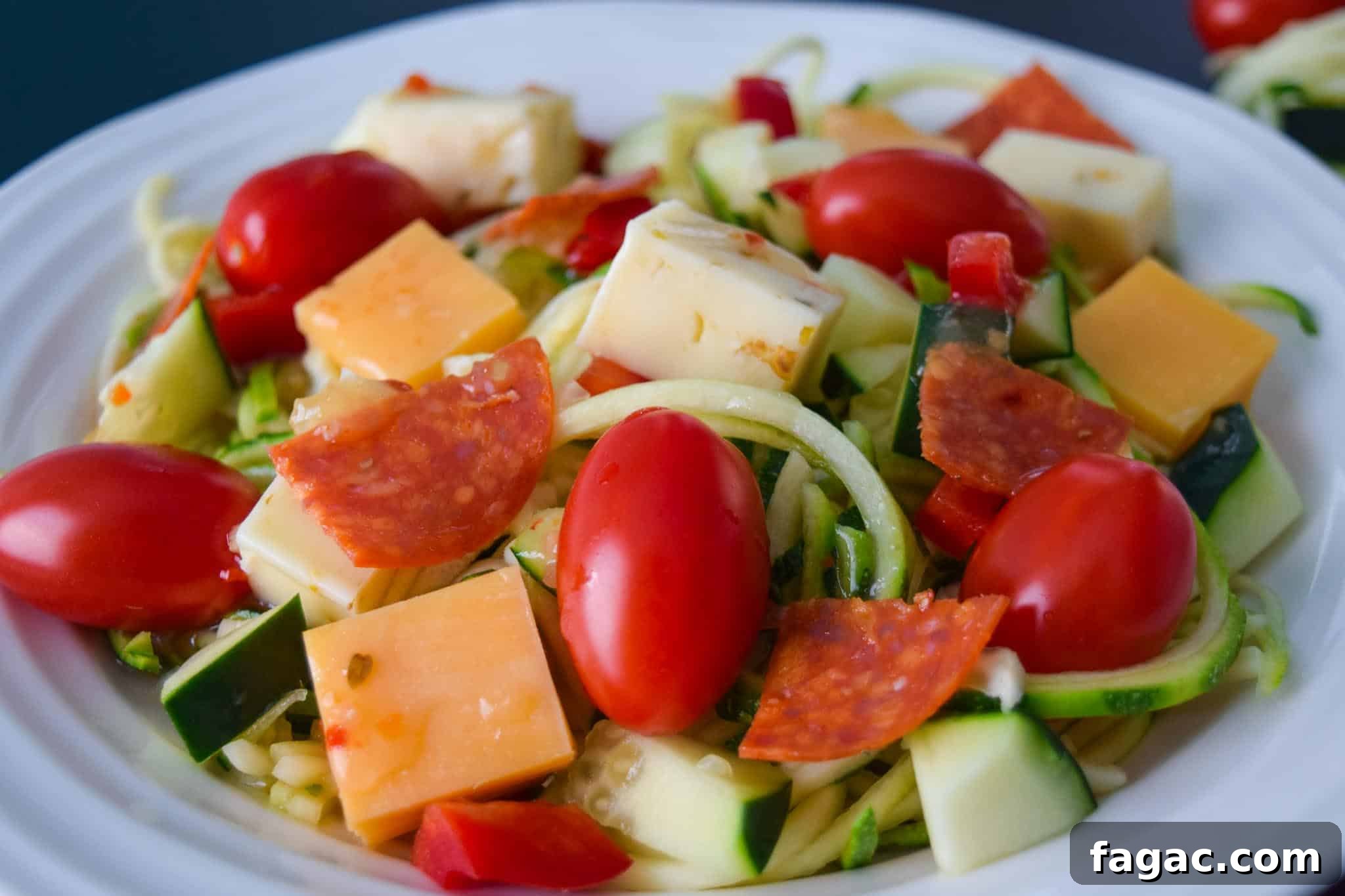 Zoodle Pasta Salad in white bowl ready to be served close up view