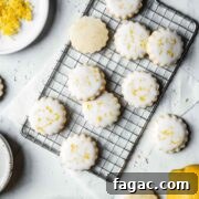 Lemon shortbread cookies with white glaze and lemon zest sprinkled on top
