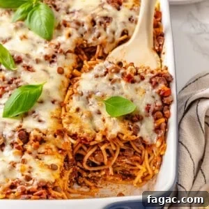 Million Dollar Spaghetti: Make-Ahead Freezer Meal Recipe 2 Spatula lifting portion of million dollar spaghetti from pan.
