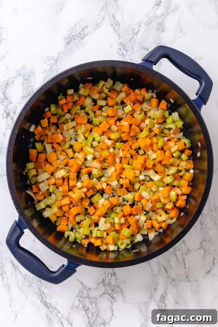 Cook the vegetables. Vegetables sauteing in pan.
