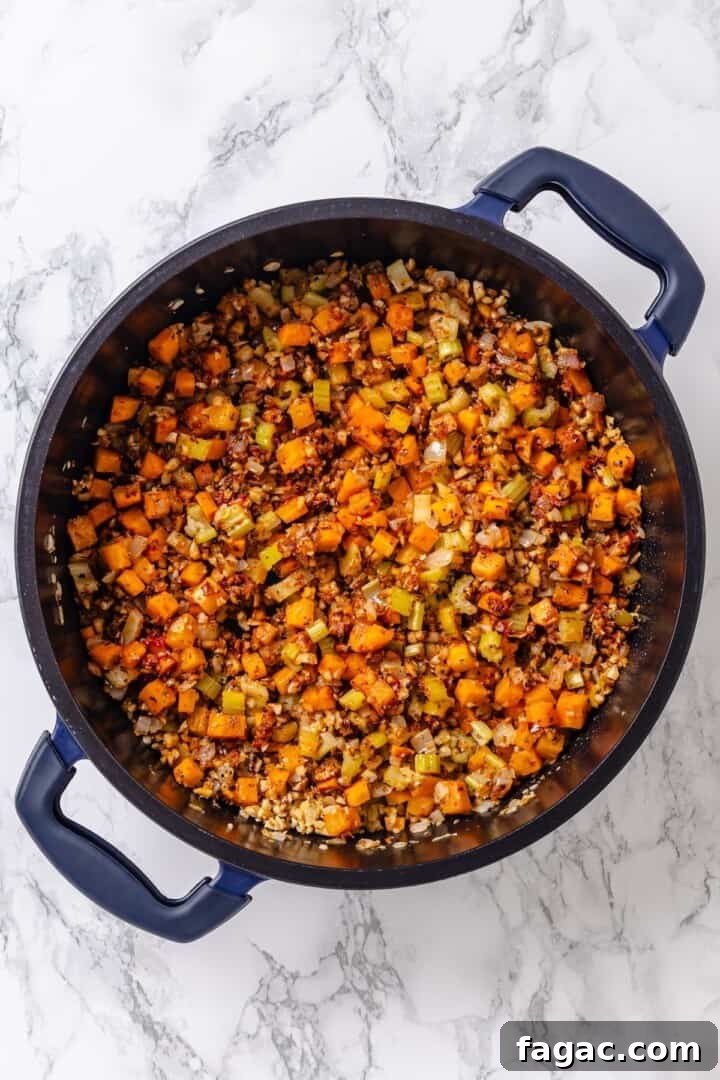 Add the walnuts, tomato paste, and seasonings. Sauteed vegetables for sauce in pan.