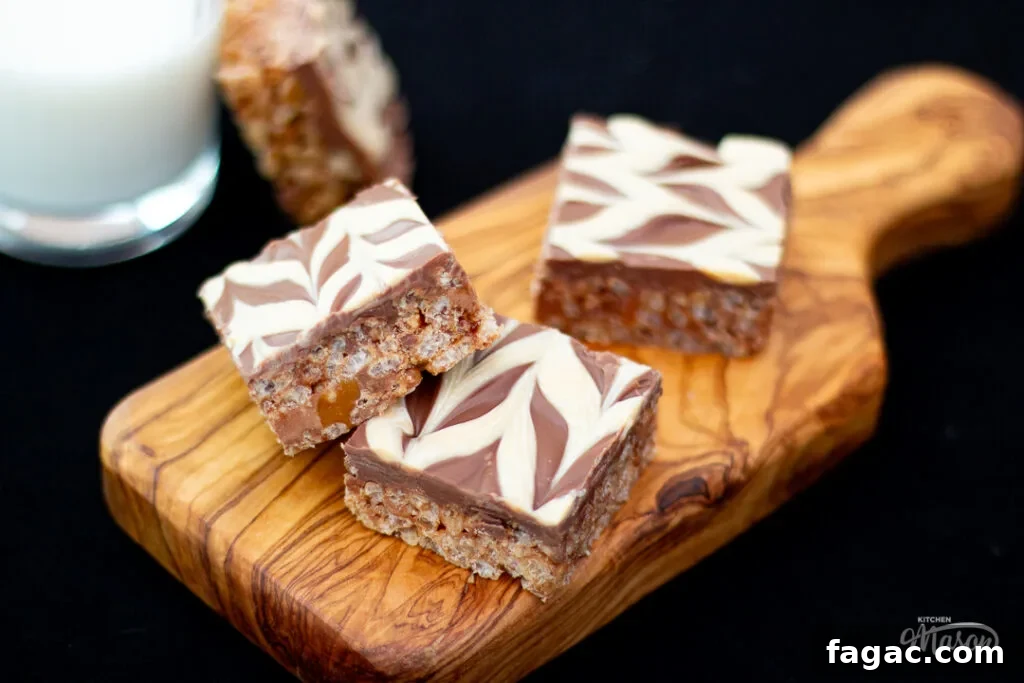 Quick Mars Bar Slice Recipe — No-Bake Chocolate Treat 13 Mars Bar Slice bars on a wooden board, with a glass of milk to the side.
