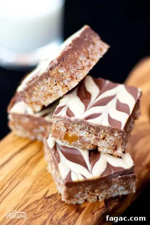 Quick Mars Bar Slice Recipe — No-Bake Chocolate Treat 3 Five bars of Mars Bar Slice on a wooden board.