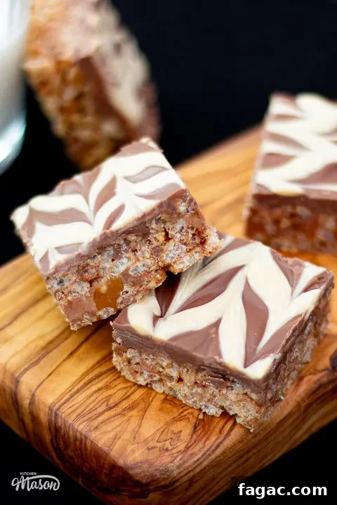 Quick Mars Bar Slice Recipe — No-Bake Chocolate Treat 4 Several slices of Mars Bar slice on a wooden chopping board.