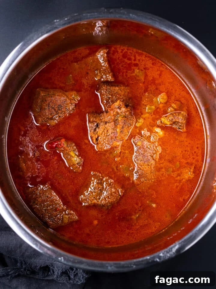 instant pot with cooked beef