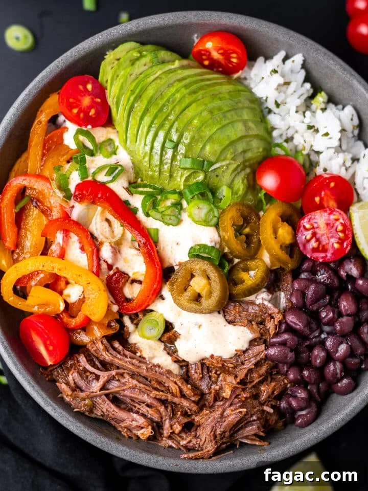 beef burrito bowl with queso sauce and veggies