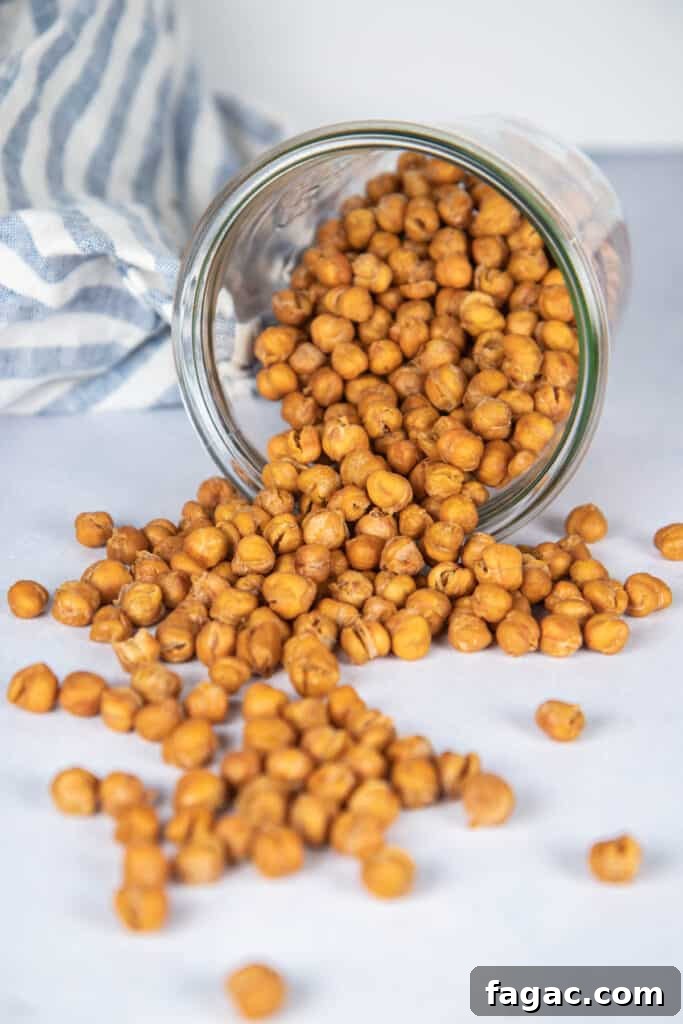 Crispy Roasted Chana (India’s Spiced Crunchy Chickpeas) 2 Jar of roasted chana spilling out in an artistic staging