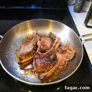 Parmesan-Crusted Lamb Chops (LongHorn Steakhouse Copycat) 5 Lamb chops being seared in a pan.