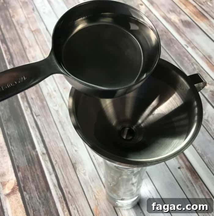 Streak-Free Homemade Glass Cleaner for Windows & Mirrors 5 Add white vinegar
