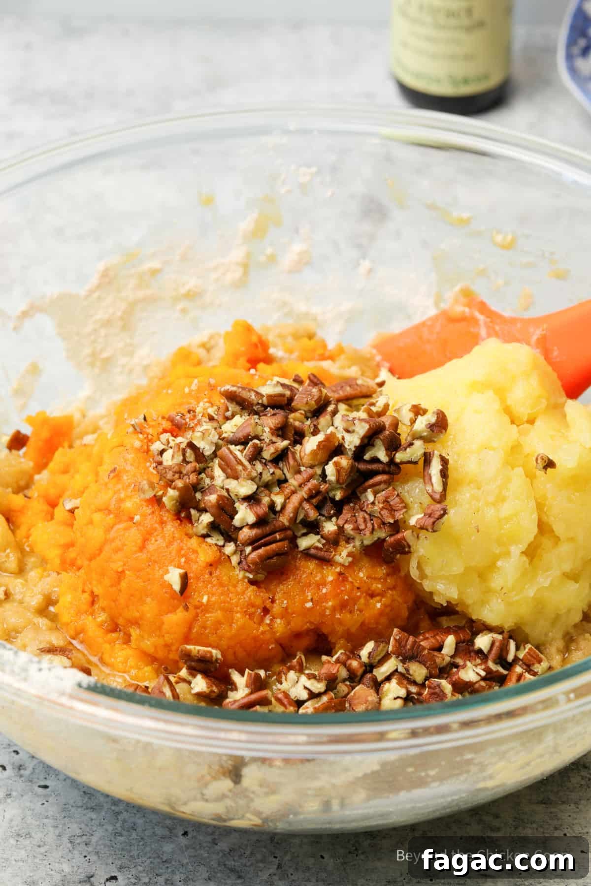 Moist Carrot Cake Recipe with Cream Cheese Frosting 7 Adding carrots, pecans and pineapple to cake batter.