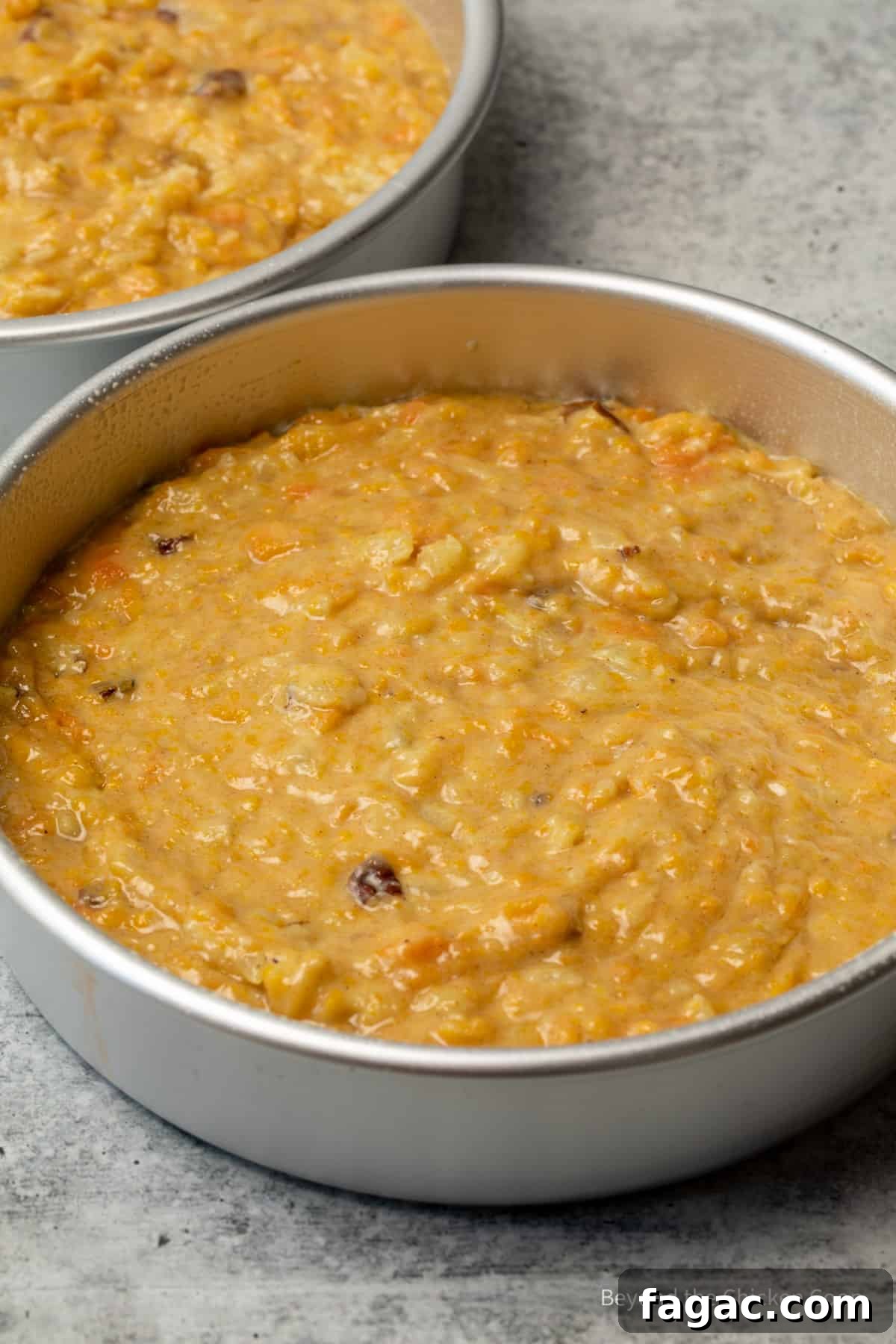 Moist Carrot Cake Recipe with Cream Cheese Frosting 8 Carrot cake batter in round cake pans.