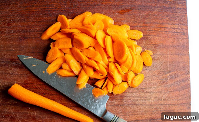 Quick Homemade Pickled Carrots: Crisp, Tangy Recipe for Jars 5 sliced carrots on wooden cutting board