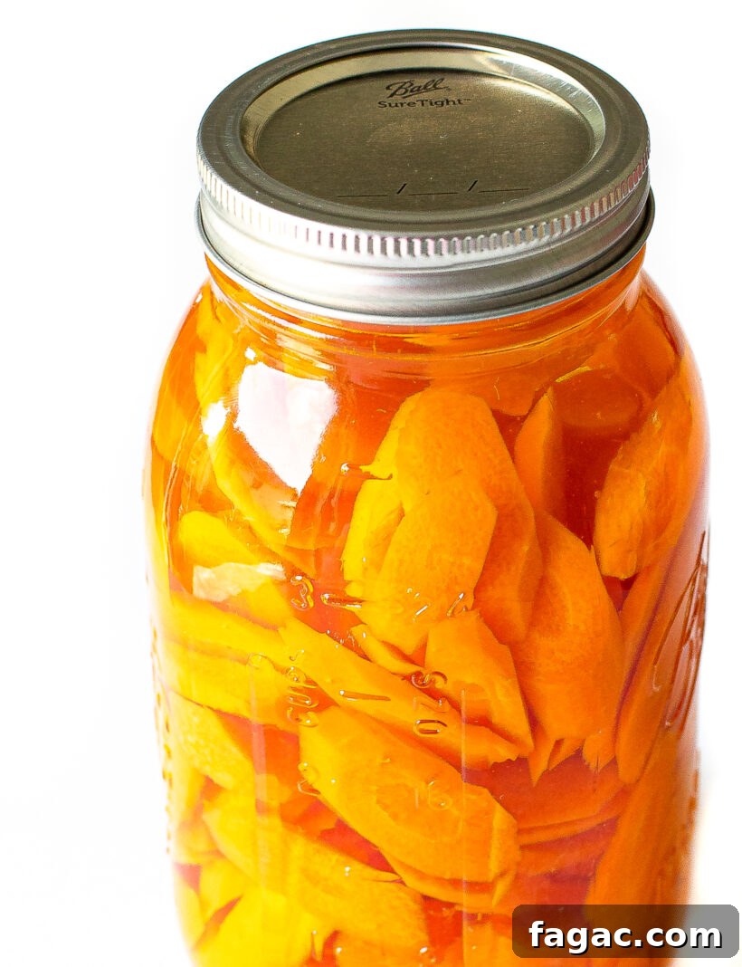 Quick Homemade Pickled Carrots: Crisp, Tangy Recipe for Jars 8 pickled carrots in mason jar with pickling liquid