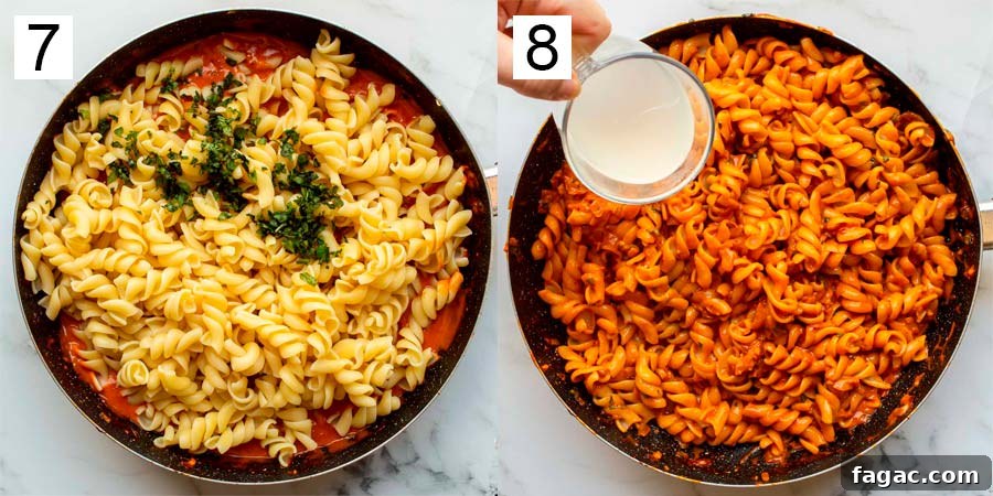 20-Minute Creamy Vegan Tomato Pasta Recipe 8 Cooked pasta mixed with creamy tomato sauce in a pan.