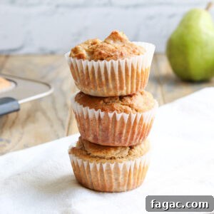 golden brown pear muffins stacked