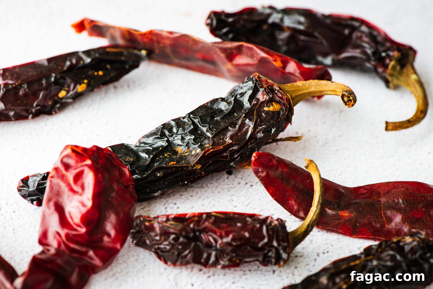 Thai Red Curry Paste Substitutes: What to Use and What to Avoid 9 A close-up of dried Jalapeño peppers and red chillies on a concrete background.
