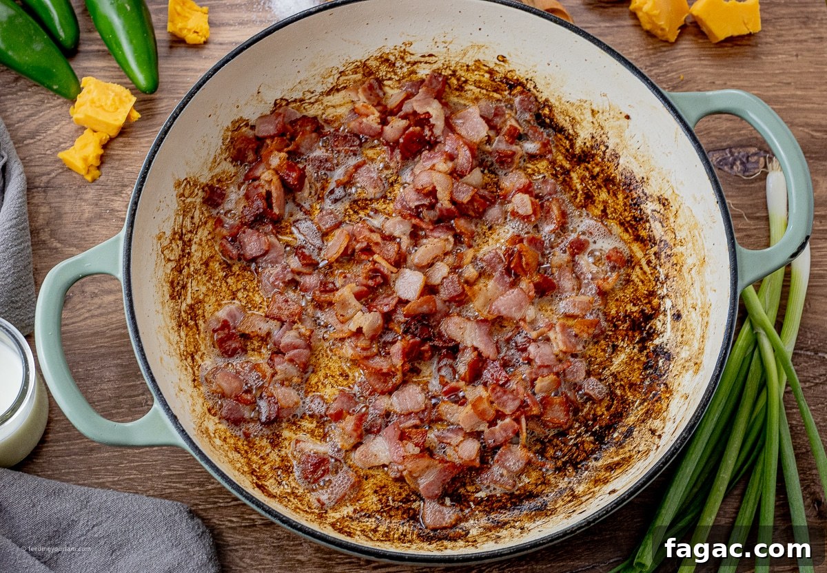 Jalapeño Popper Macaroni and Cheese Recipe 4 cooked chopped up pieces of bacon in a large round pan