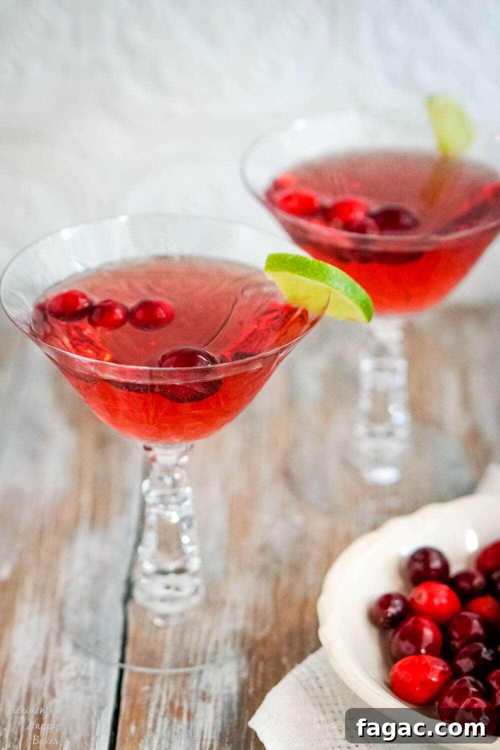 Two crystal glasses of cranberry moscato punch.