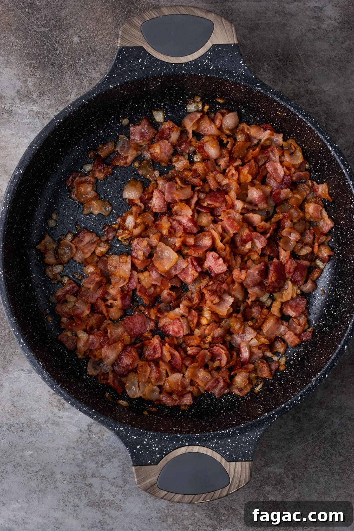 Caramelized onion and bacon in a cast iron skillet.