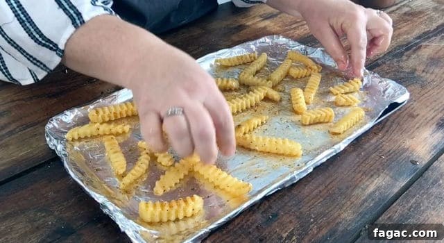 Crispy Frozen French Fries: Oven & Air Fryer Methods for Perfect Results 3 baking sheet and frozen fries.